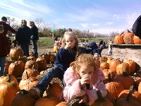 Haven and Natalie posing with cider