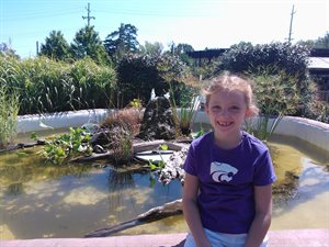 This is Natalie posing by the fountain at the zoo