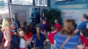The tourguide explaning about the steam boat and where it was found