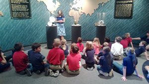 The tourguide said there were thousands of buttons found, because the clothing had rotted away