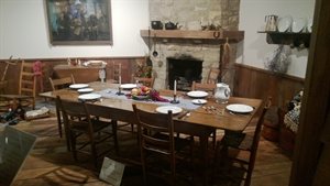 A complete dinning table with dishes and silverware