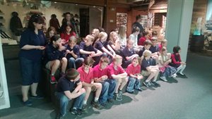 The class passing around some spikes and peices of mud