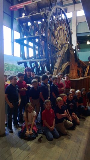 All the kids under the paddle wheel