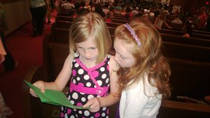 Natalie and Reese looking over the program