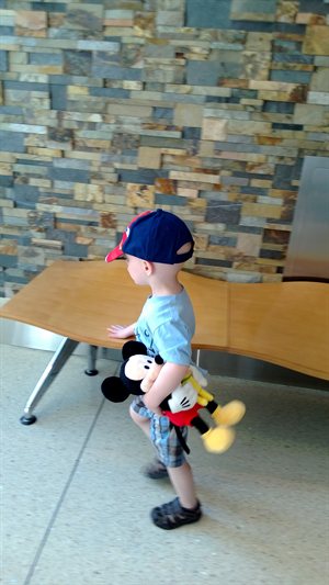 Nathan and Mickey walking to the hospital side of KU Med