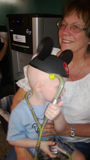 Mom holding Nathan in Admissions